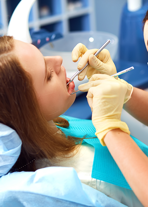 A dentist working on a patient.